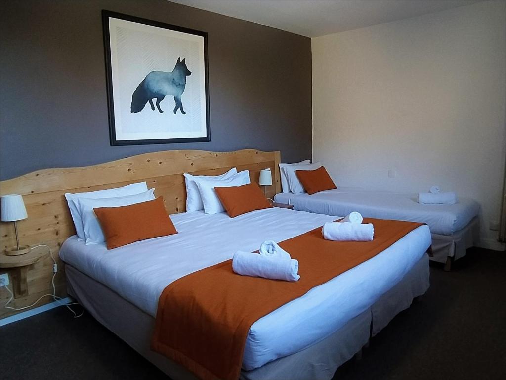 Postel nebo postele na pokoji v ubytování Hôtel Aalborg