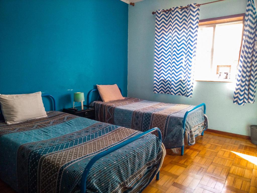 Postel nebo postele na pokoji v ubytování Enjoy Braga Estação - Charming Bedrooms in the Historic Center