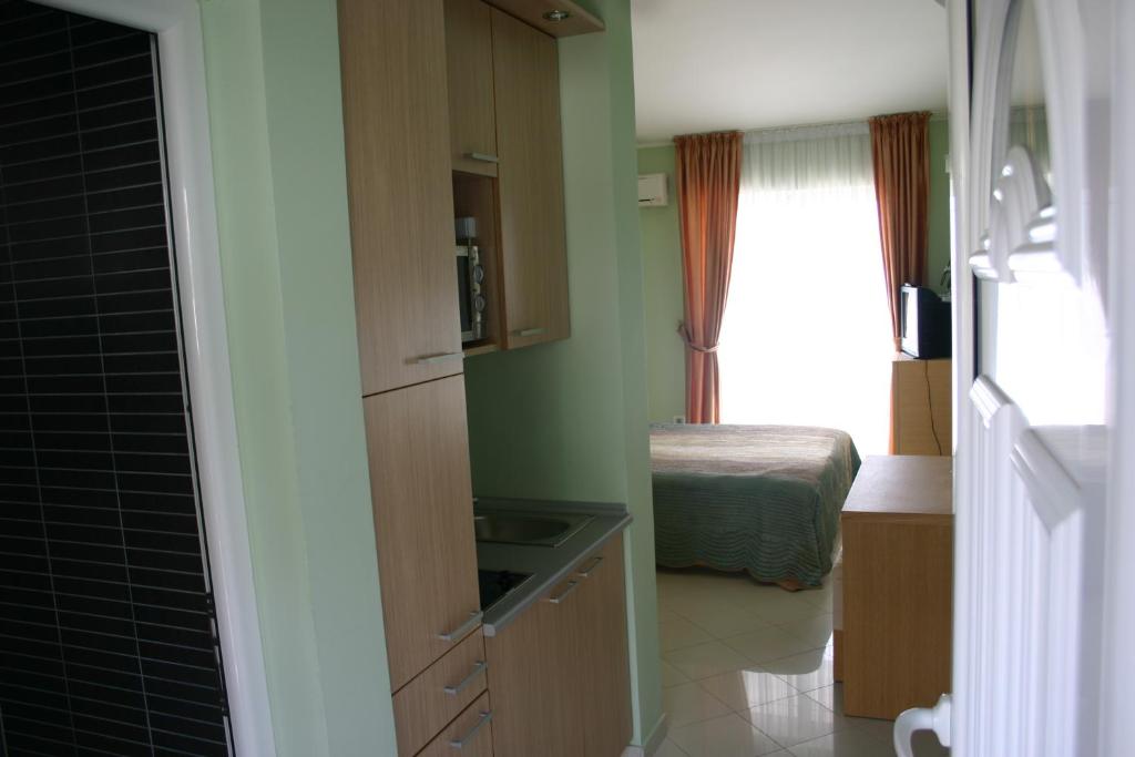 Postel nebo postele na pokoji v ubytování Apartments & Rooms Elite