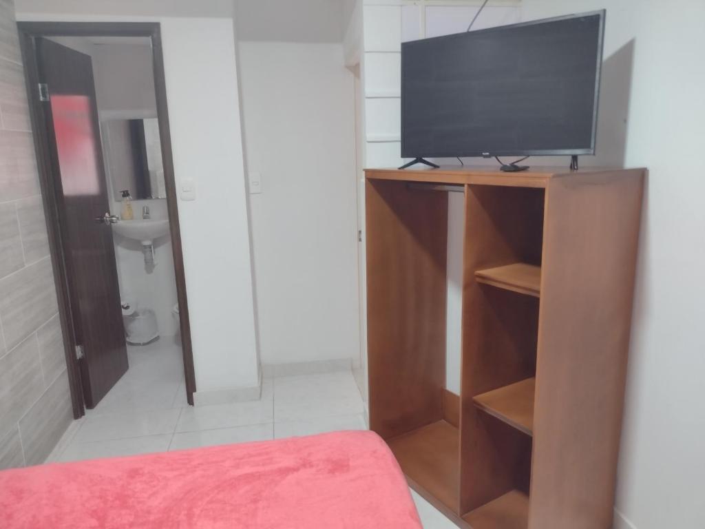 TV a/nebo společenská místnost v ubytování Hotel Risaralda