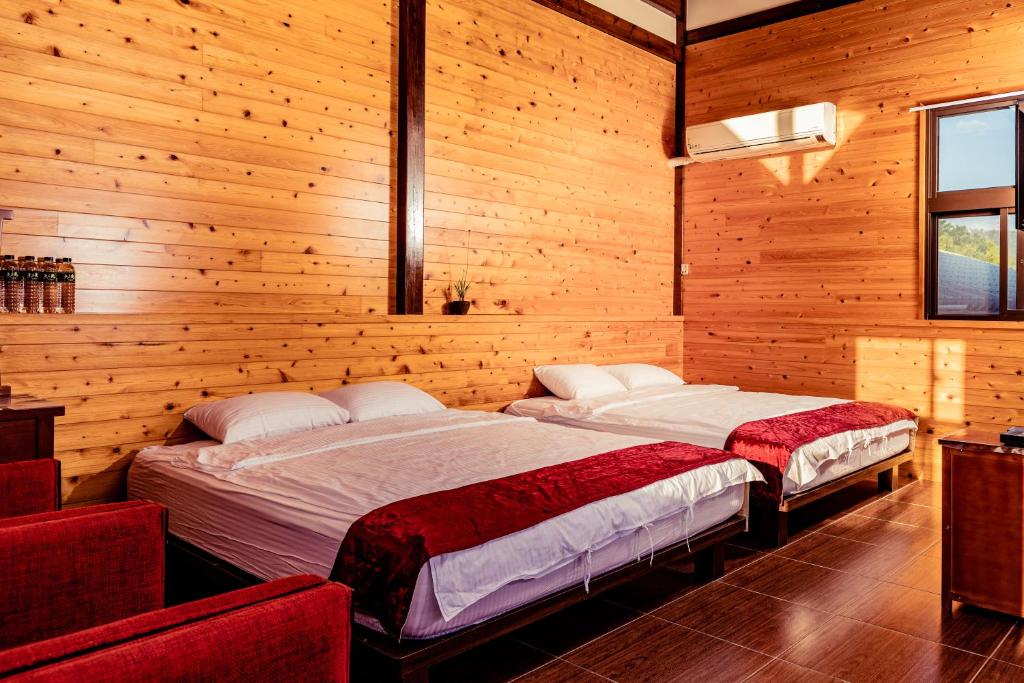 Postel nebo postele na pokoji v ubytování Cui Song Yuan Homestay