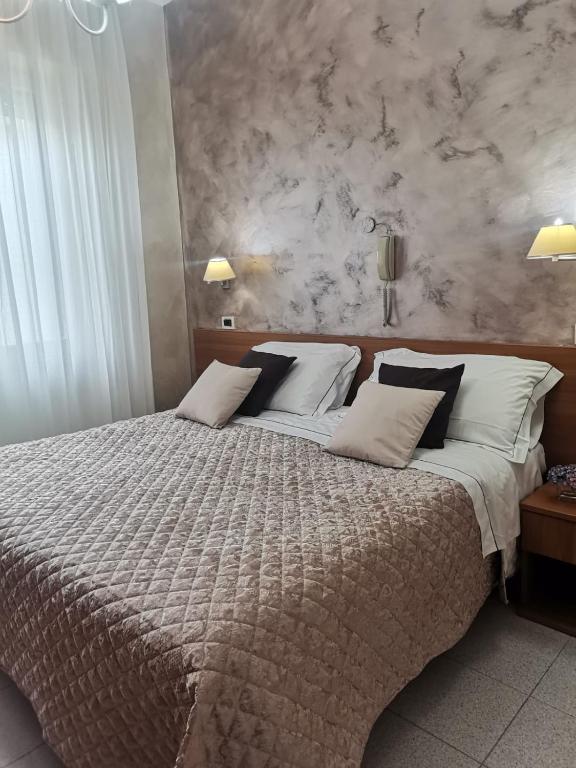 Postel nebo postele na pokoji v ubytování Hotel Marconi