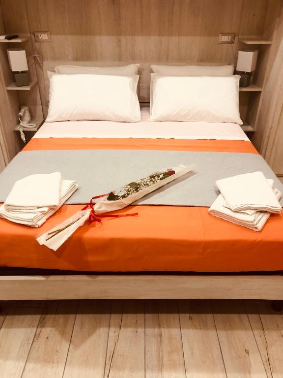 Postel nebo postele na pokoji v ubytování YourHome - La Meta Perfetta Rooms&Spa