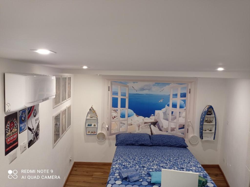 A bed or beds in a room at Casa Titanic Siracusa