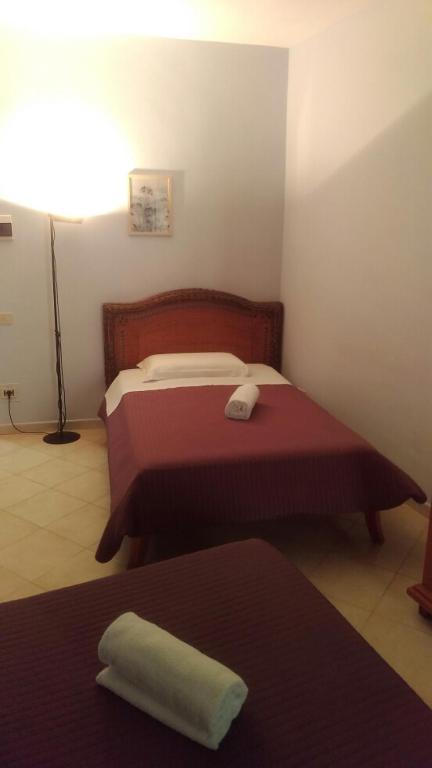 Postel nebo postele na pokoji v ubytování B Palace