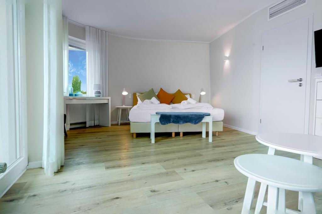 Postel nebo postele na pokoji v ubytování Hotel Seeliebe