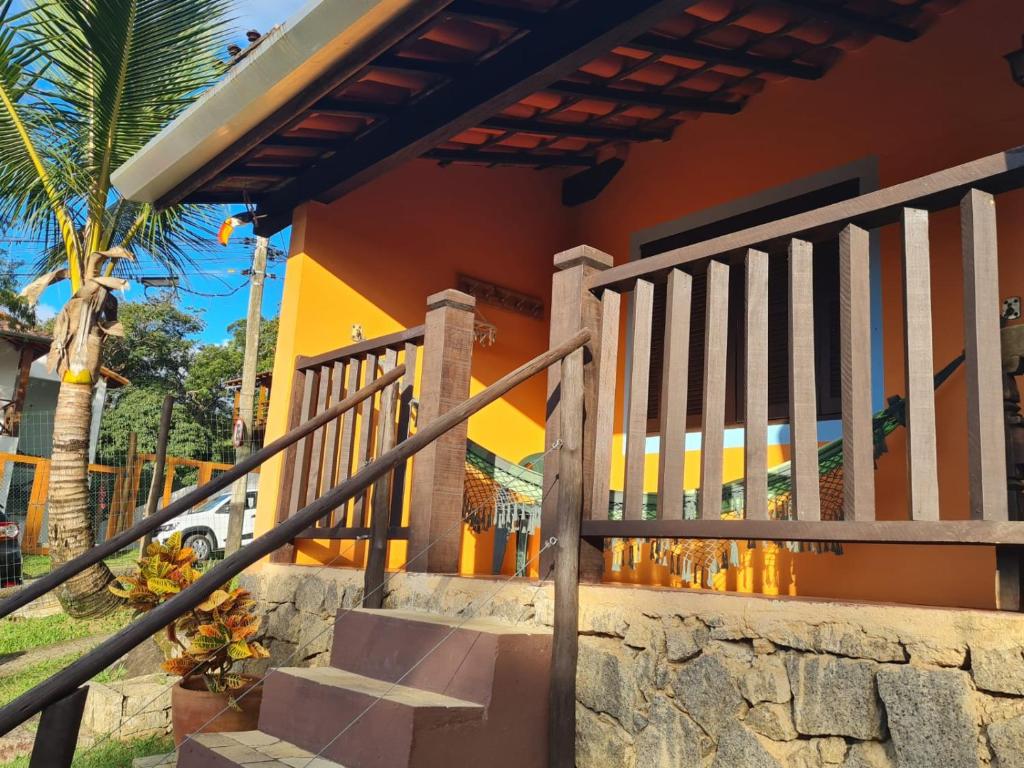 a staircase leading to a house with a building at Pousada Por do Sol in Ilhabela