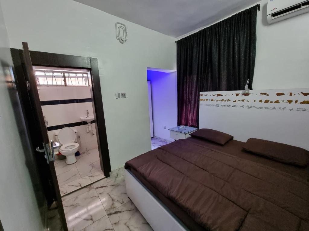 Postel nebo postele na pokoji v ubytování CG Apartments