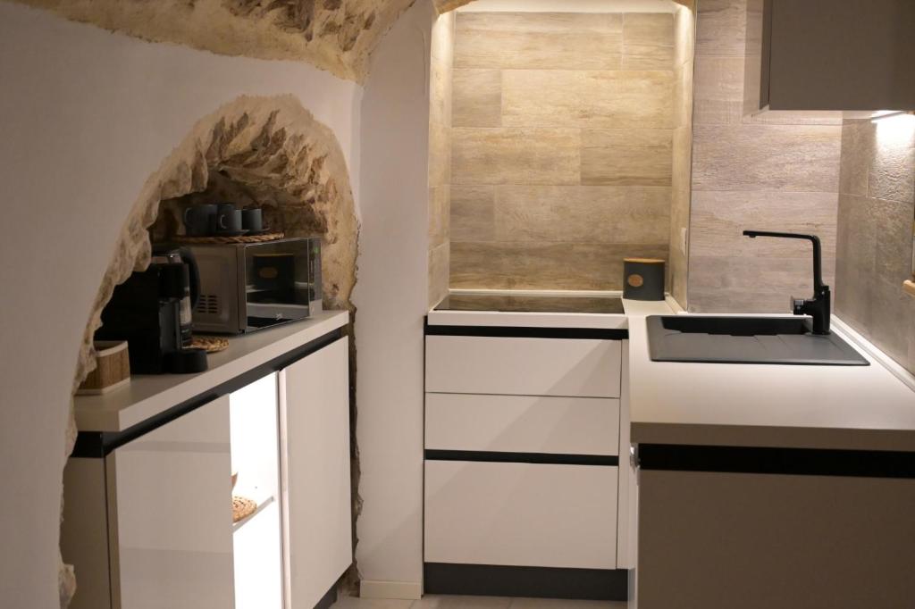 Kuchyň nebo kuchyňský kout v ubytování Pietrabianca Santa Maria Apartments