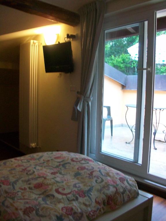 Postel nebo postele na pokoji v ubytování B&B L'Albero Maestro