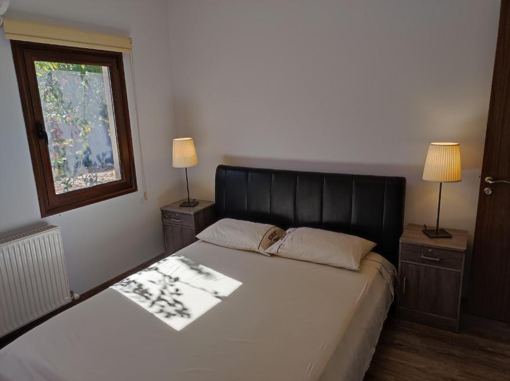 Postel nebo postele na pokoji v ubytování Roses Villa