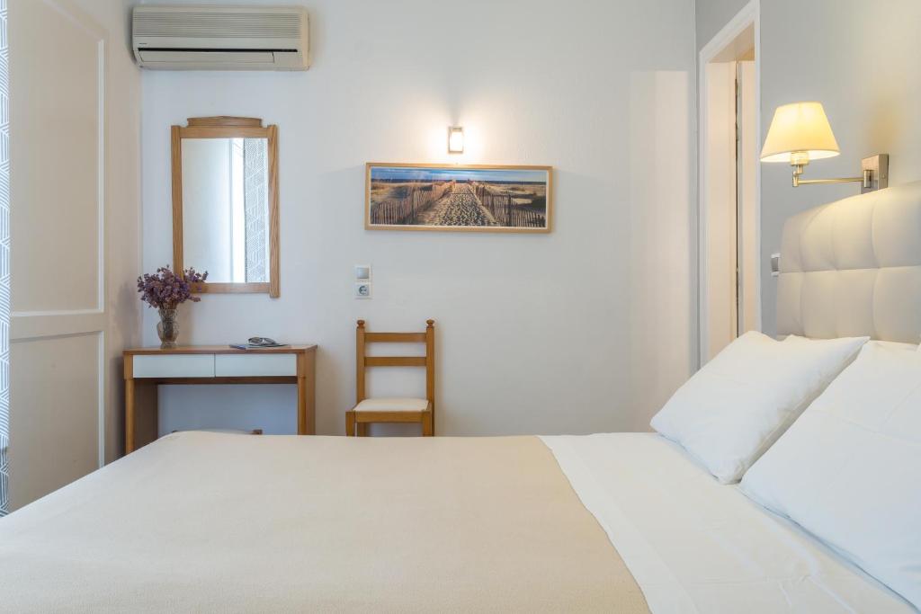 Postel nebo postele na pokoji v ubytování Hotel Akti