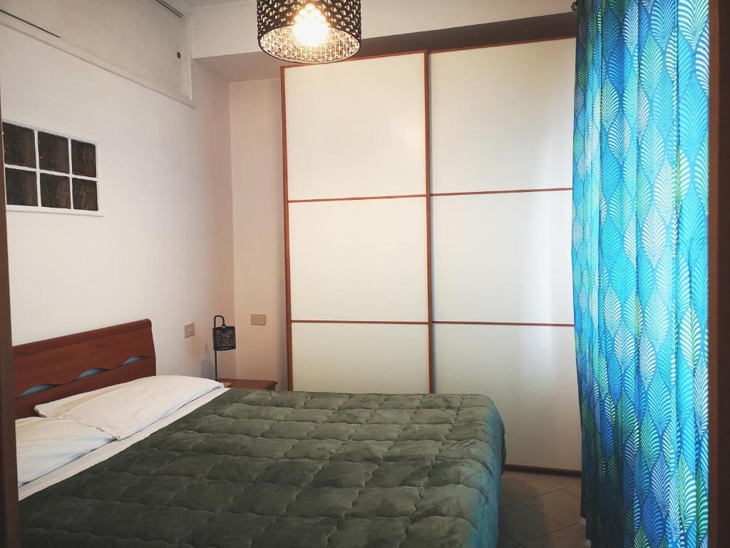 Postel nebo postele na pokoji v ubytování Appartamento Jungle Beach