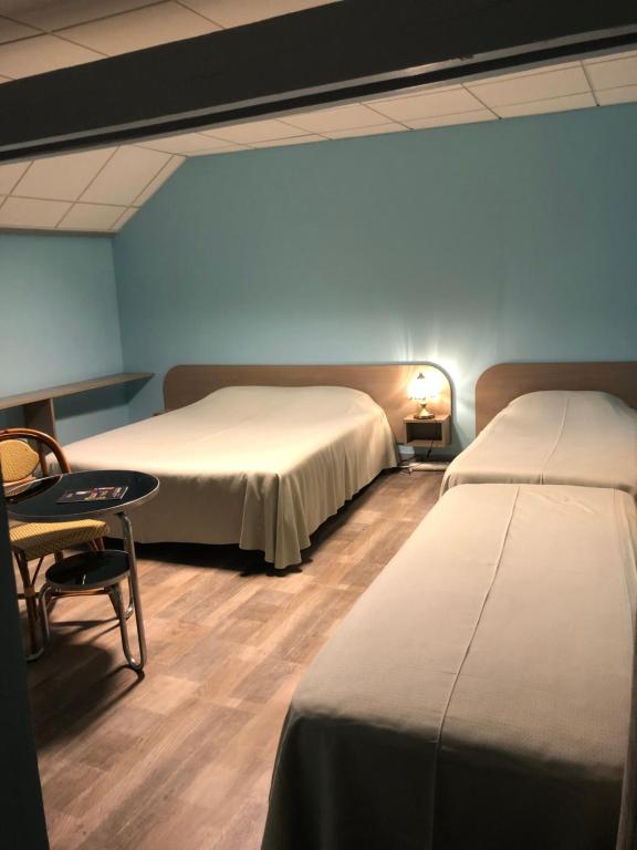 Postel nebo postele na pokoji v ubytování Hôtel Restaurant De La Mare