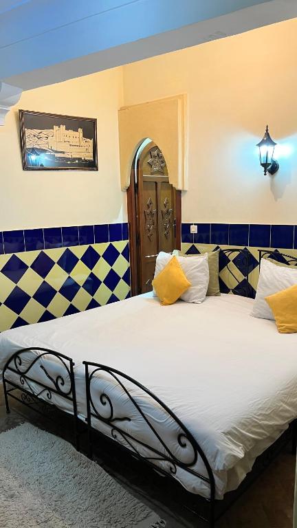 Postel nebo postele na pokoji v ubytování Riad Hôtel Belleville Marrakech