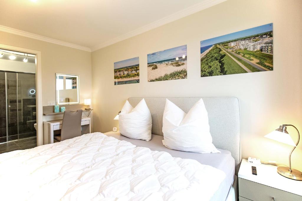 Postel nebo postele na pokoji v ubytování Villa Deichgraf 7 "Ostseeblick"