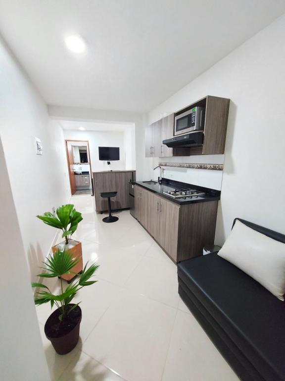 Η κουζίνα ή μικρή κουζίνα στο Apartaestudio Centro Comercial la Central