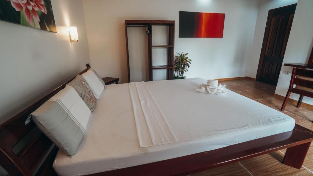 Postel nebo postele na pokoji v ubytování Point 303 Resort