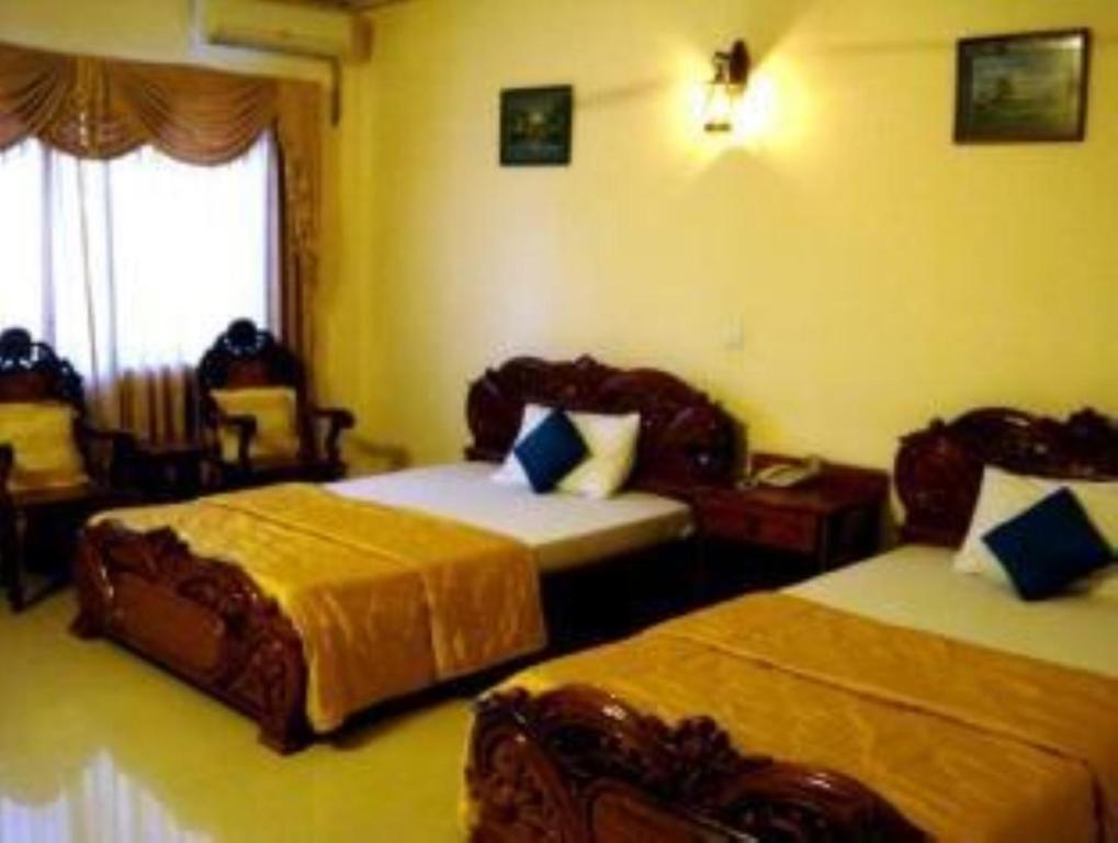 Postel nebo postele na pokoji v ubytování Star Hotel