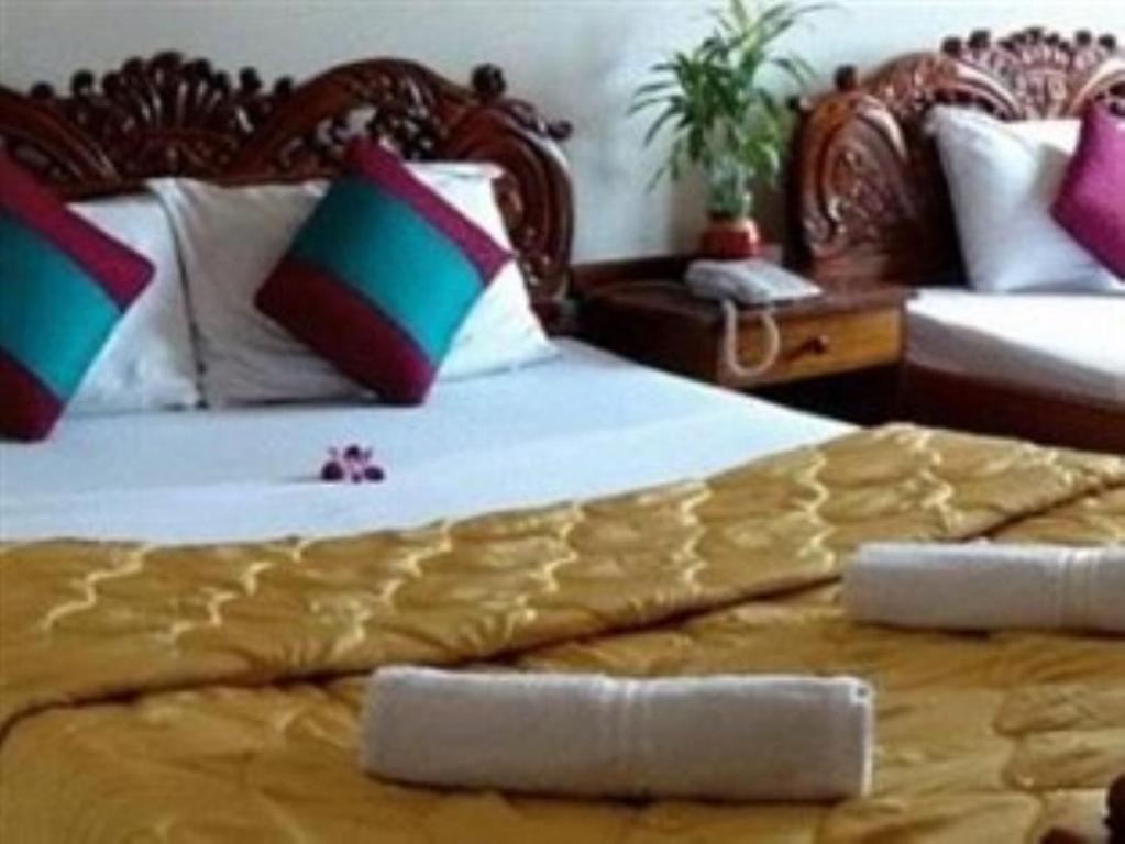 Postel nebo postele na pokoji v ubytování Star Hotel