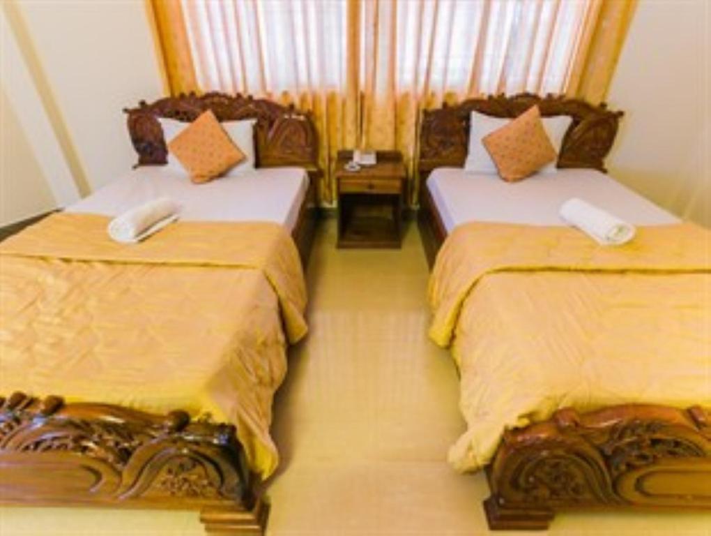 Postel nebo postele na pokoji v ubytování Star Hotel