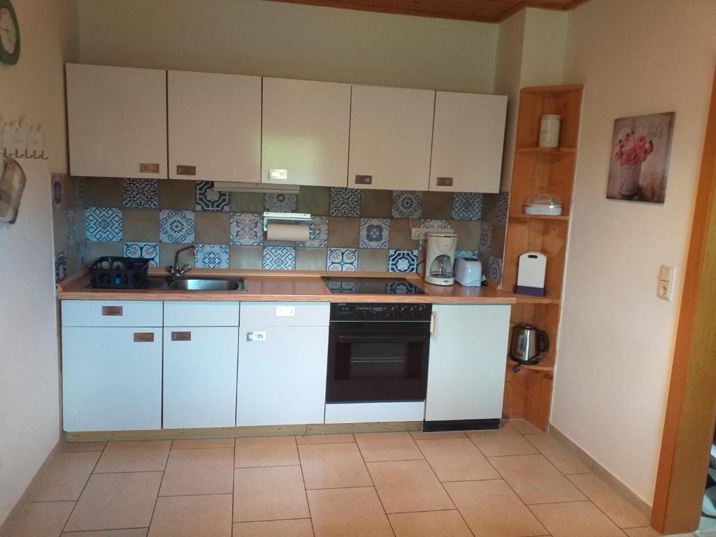 Kuchyň nebo kuchyňský kout v ubytování Ferienwohnung Steinbeisser