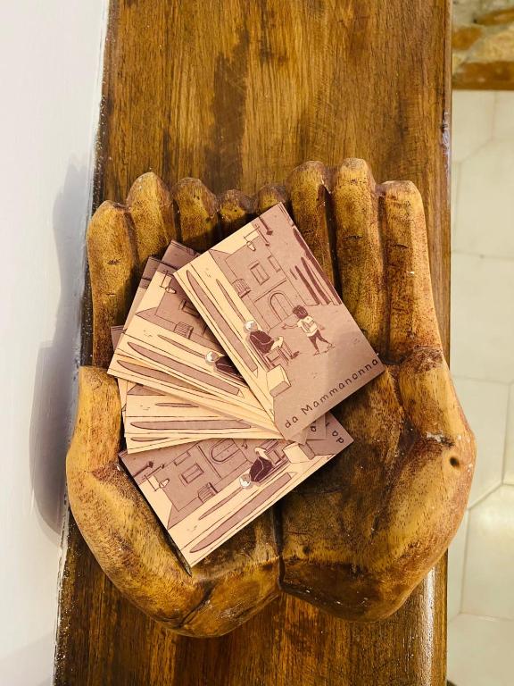 a pile of money in a baseball glove at Casa vacanze Da Mammanonna in Taurasi