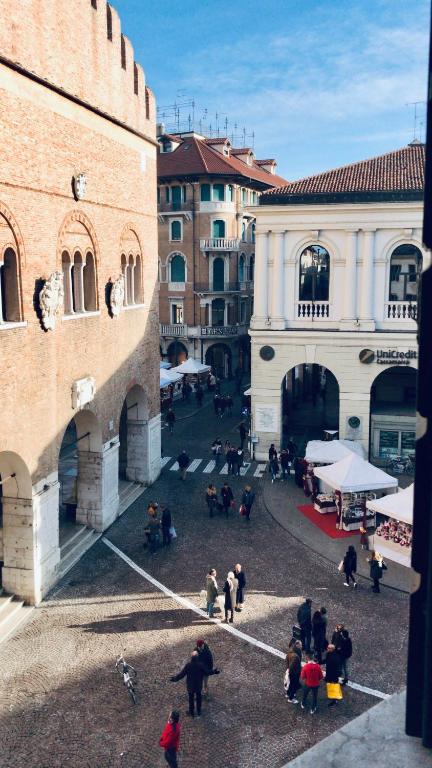 a group of people standing around in a courtyard at Suite300 by Palazzina300 in Treviso