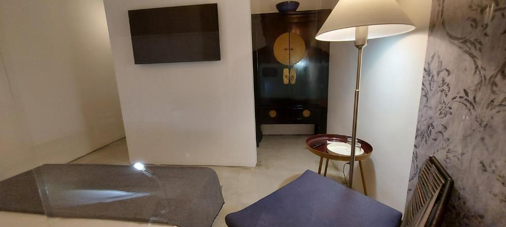 Televízia a/alebo spoločenská miestnosť v ubytovaní Loft 19