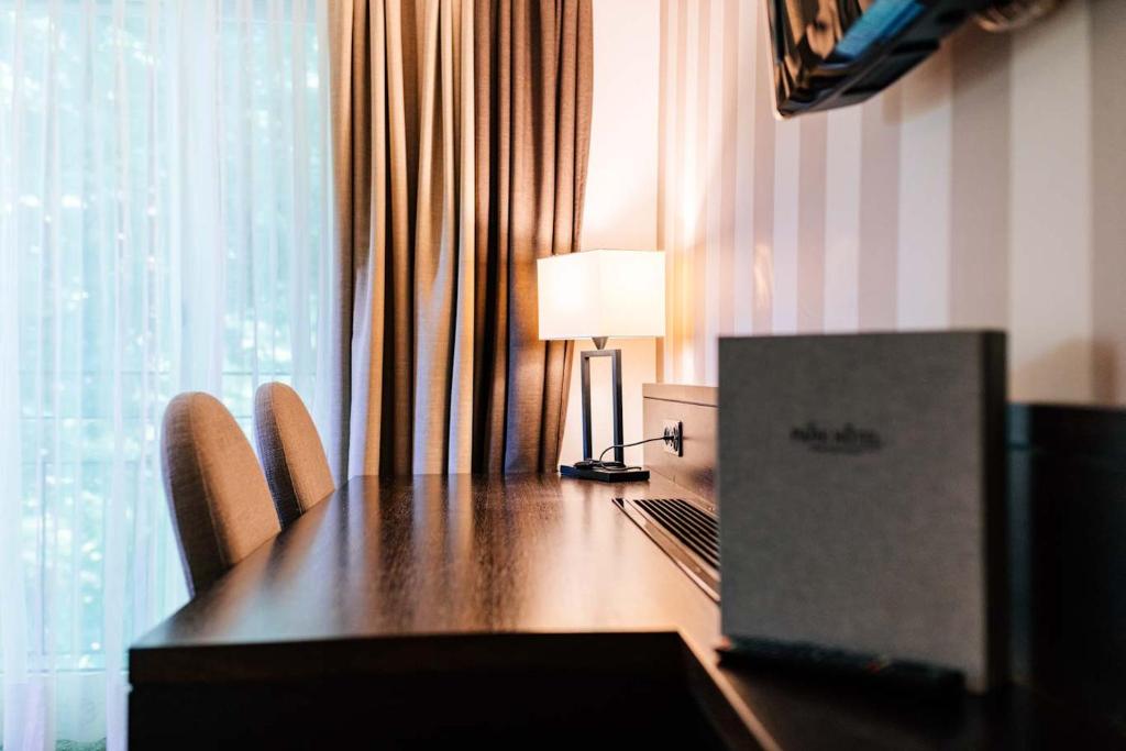 TV a/nebo společenská místnost v ubytování Park Hotel Winterthur
