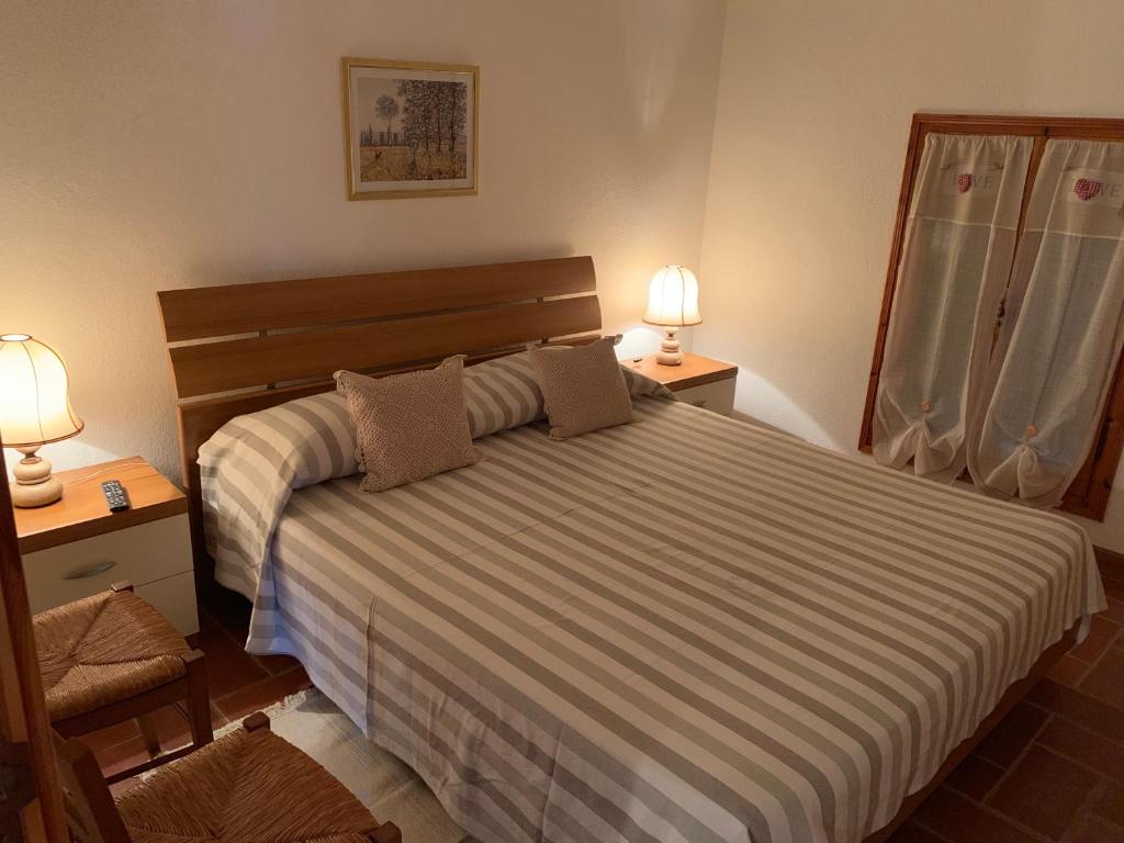Łóżko lub łóżka w pokoju w obiekcie B&B Codivilla
