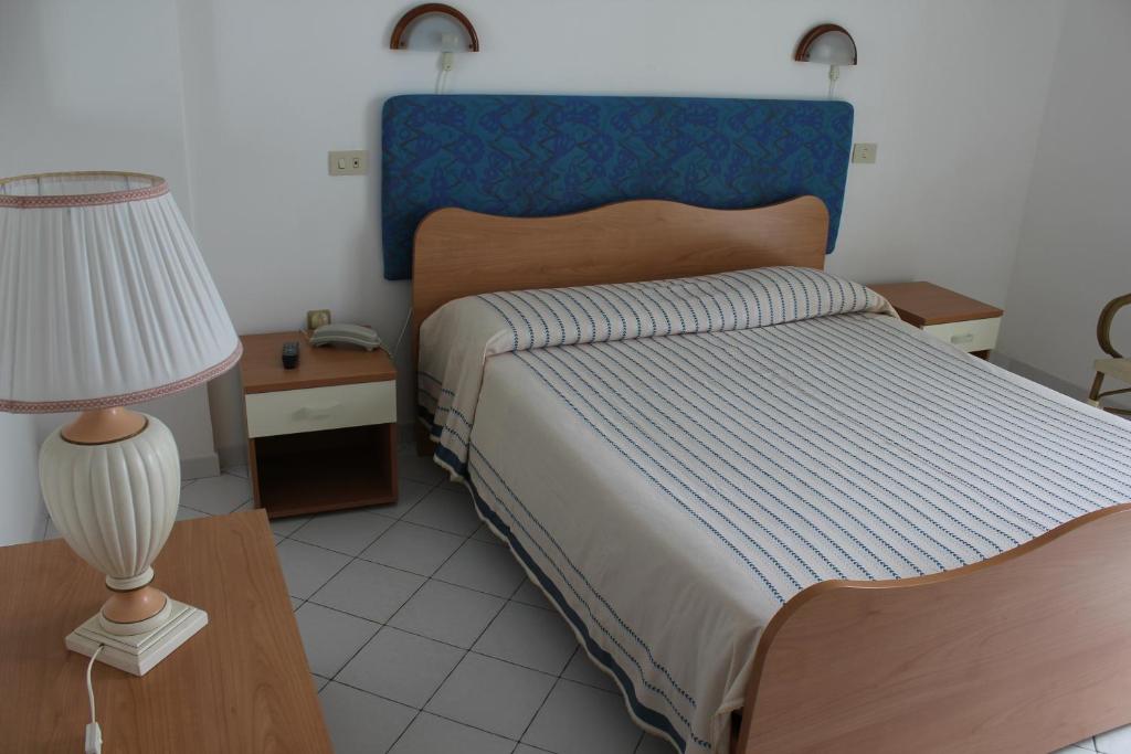 Postel nebo postele na pokoji v ubytování Hotel Ristorante Mareblu