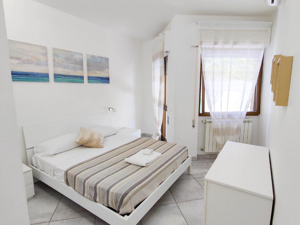 A bed or beds in a room at Casa del Mare