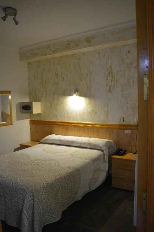 Postel nebo postele na pokoji v ubytování Hostal Manolete
