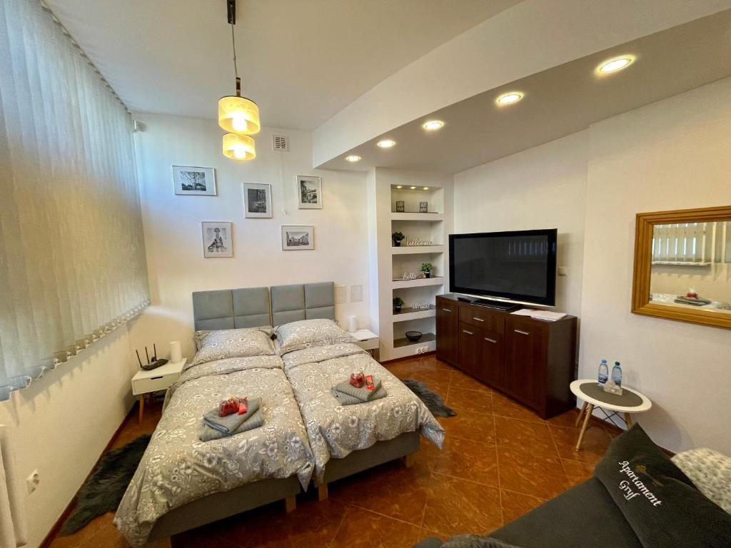 Ένα ή περισσότερα κρεβάτια σε δωμάτιο στο Apartament Gryf