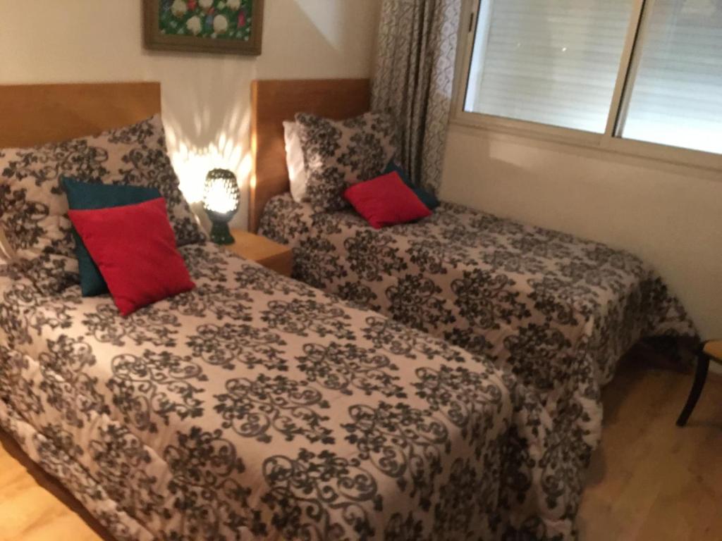 A bed or beds in a room at LA Perle de nouaceur