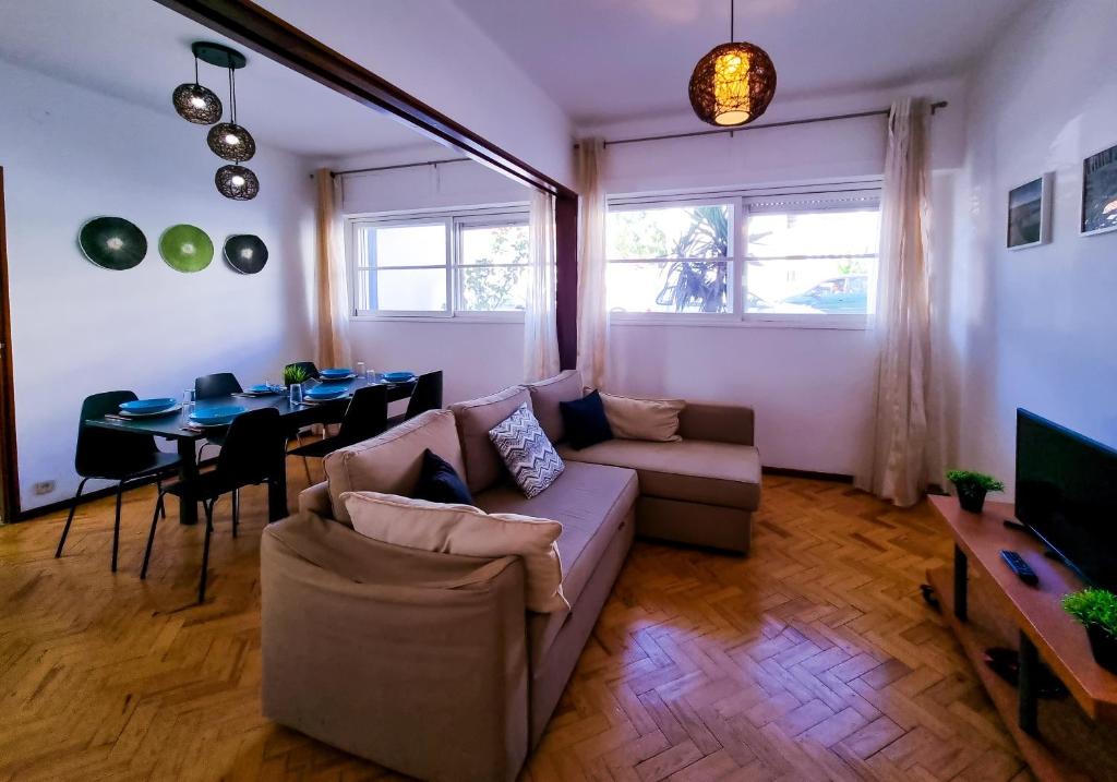 a living room with a couch and a table at FLH Loulé Balcony Spacey Apartment in Loulé