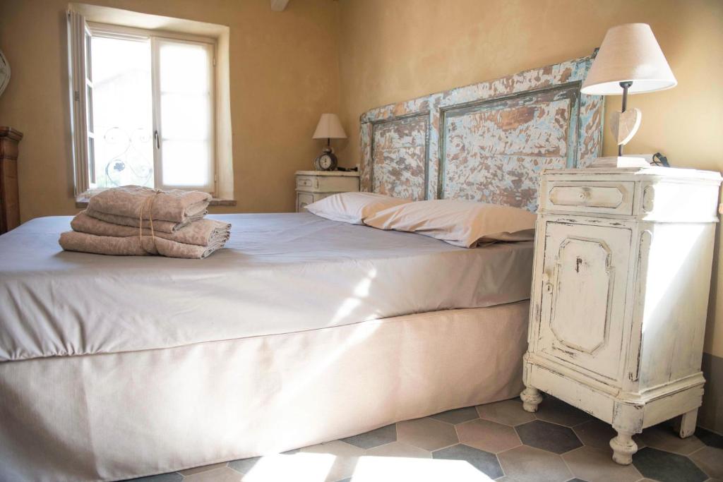 Postel nebo postele na pokoji v ubytování Borgo dei Gatti Albergo Diffuso & spa