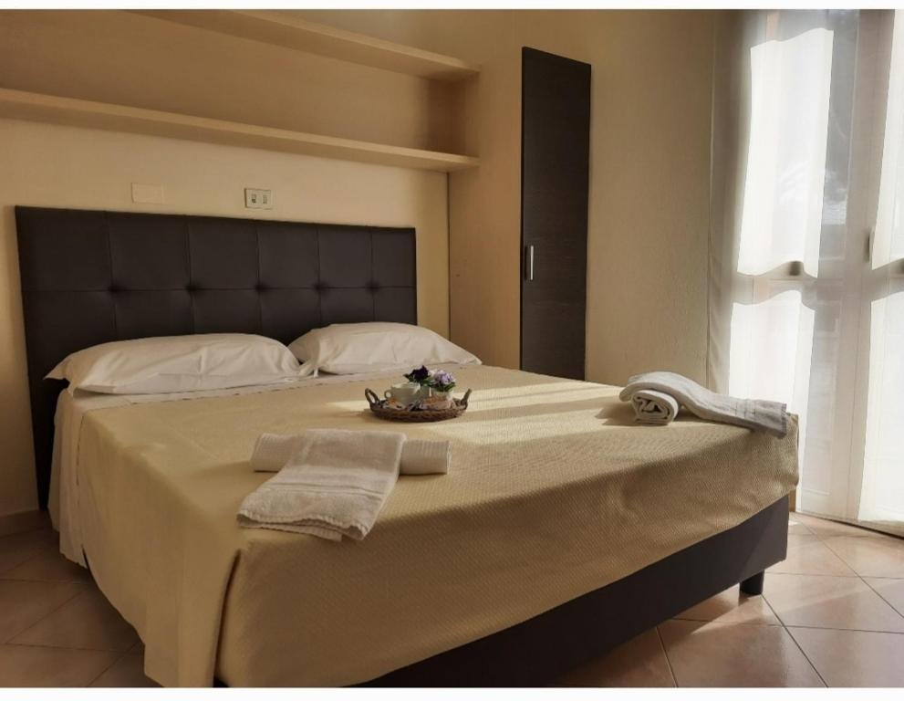 Postel nebo postele na pokoji v ubytování R&B Hotel