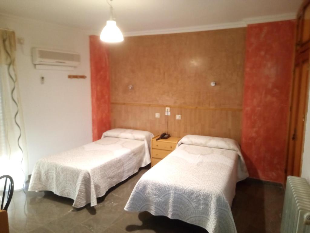 Postel nebo postele na pokoji v ubytování Hostal Manolete