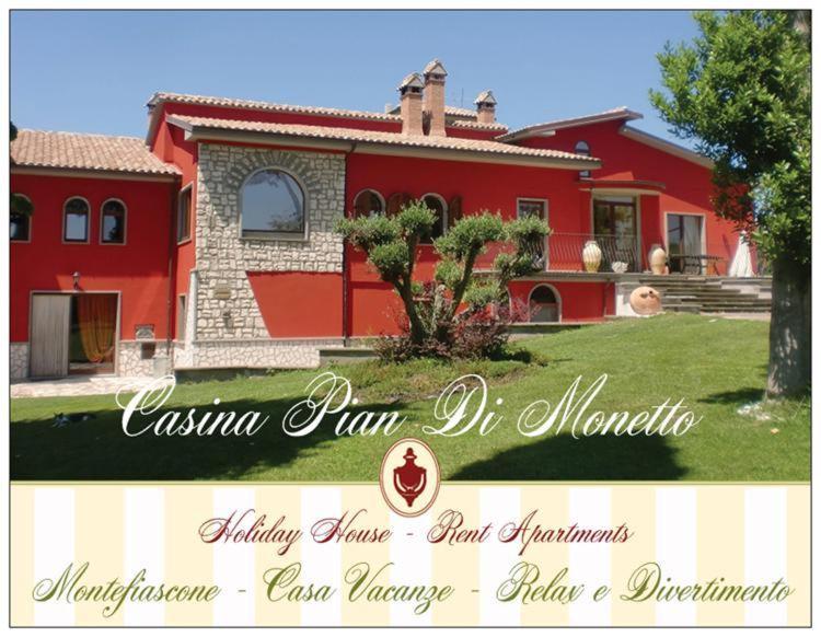 a picture of a house with a red house at Casina Pian Di Monetto in Montefiascone