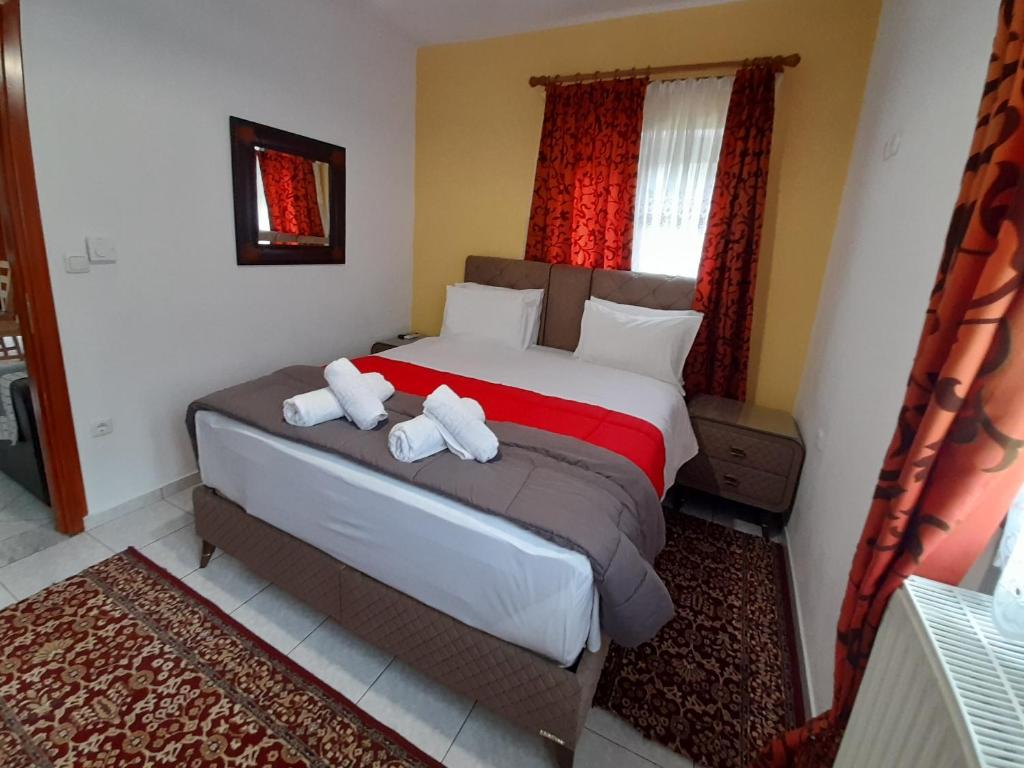 Postel nebo postele na pokoji v ubytování Zosimas House