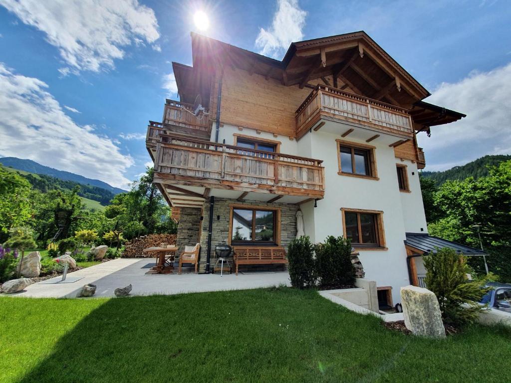 a large house with a balcony on top of it at Rocks Schladming in Schladming
