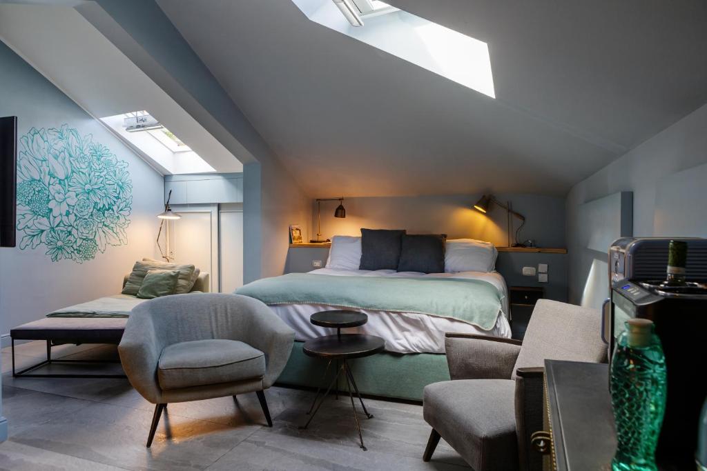 Uma cama ou camas num quarto em Bello!Lake Como Suites