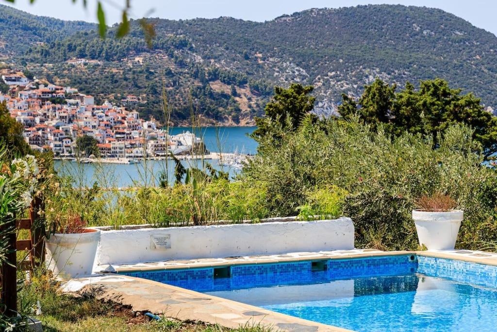 a swimming pool with a view of a city at Villa Rodia with swimming pool on Skopelos Island in Skopelos Town