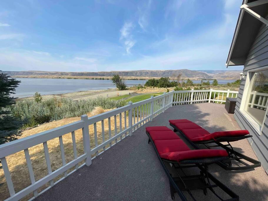 a porch with chairs and a view of the water at Crescent Bar Waterfront Home- Private Beach, Water Views, Hiking, Golf, Live Concerts in Quincy
