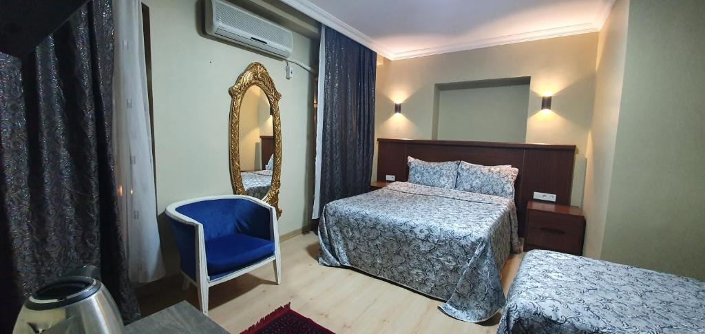 Postel nebo postele na pokoji v ubytování Sehir Apart Hotel