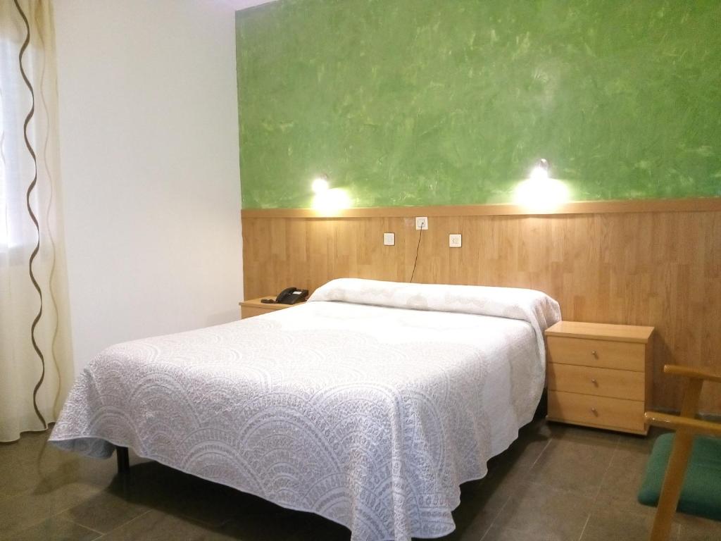 Postel nebo postele na pokoji v ubytování Hostal Manolete