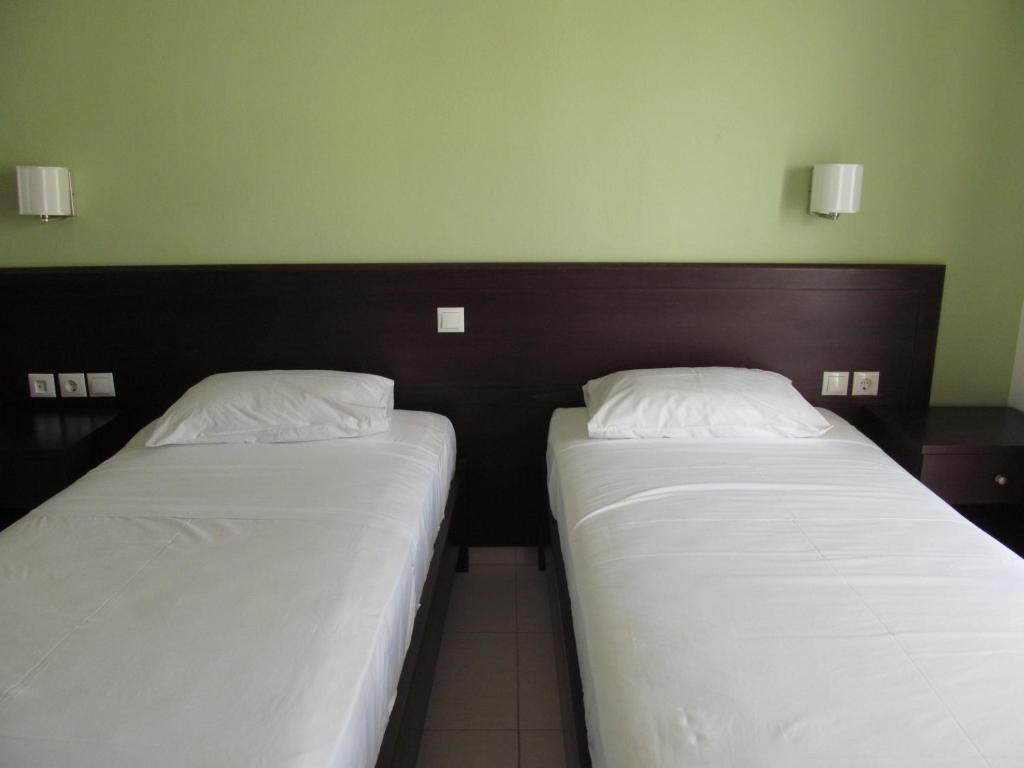 Postel nebo postele na pokoji v ubytování Rio Hotel