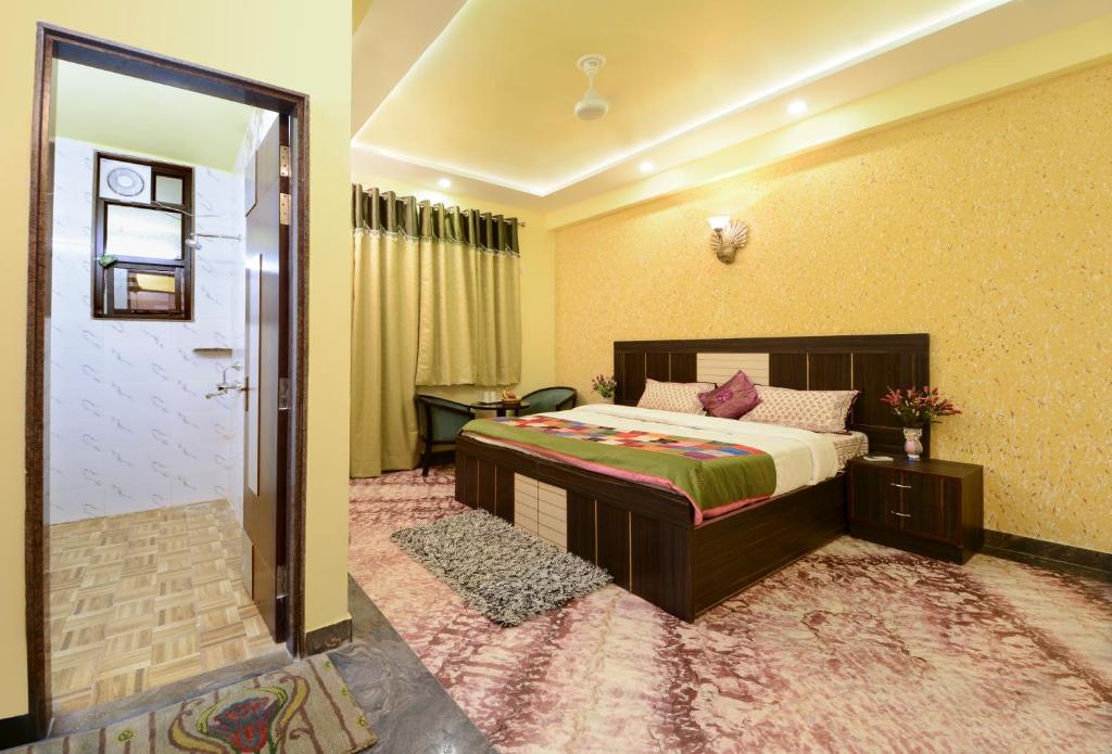 Postel nebo postele na pokoji v ubytování Rainbow Home Stay